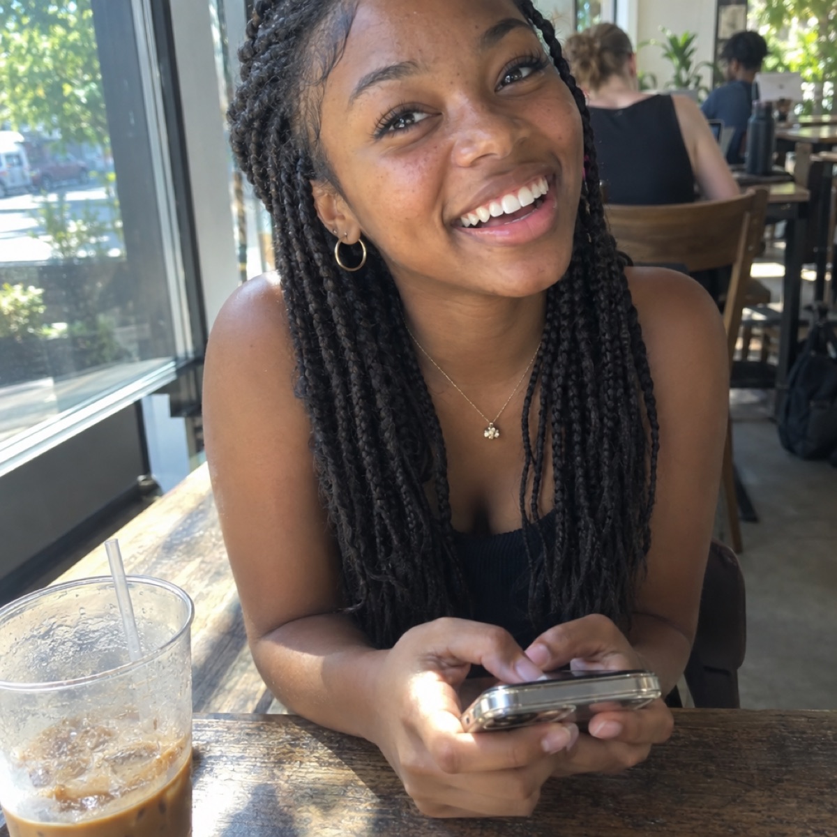 A student texting in a cafe